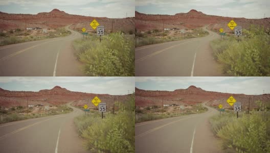在蜿蜒的沙漠公路上驾驶汽车高清在线视频素材下载