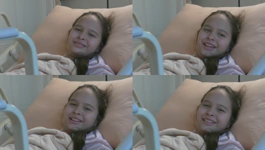 亚裔美国少女躺在病床上微笑着高清在线视频素材下载