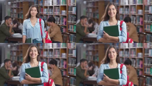 女学生在大学图书馆的肖像高清在线视频素材下载