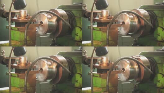 用切割机对钢轴进行钻孔的金属加工机器高清在线视频素材下载