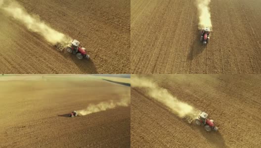 AERIAL SLO MO农民用拖拉机耕地高清在线视频素材下载