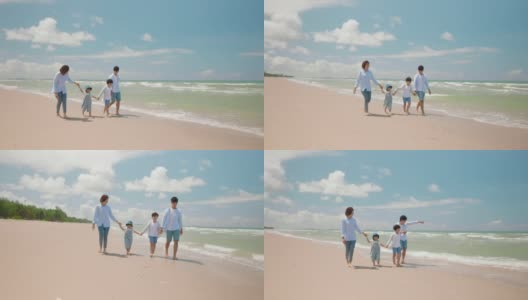 亚洲的爸爸和妈妈在夏天和孩子一起玩，沿着海滩散步。父母和孩子们去海边度假。幸福家庭关系理念。后视图和慢动作高清在线视频素材下载