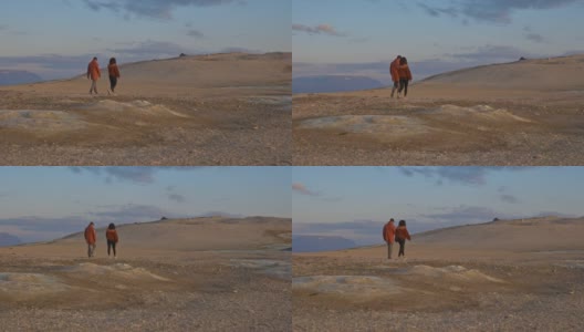 探险者在冰岛广袤的地热田漫步的广角镜头高清在线视频素材下载