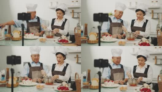 甜点师和他的助手一起做浆果蛋糕。高清在线视频素材下载