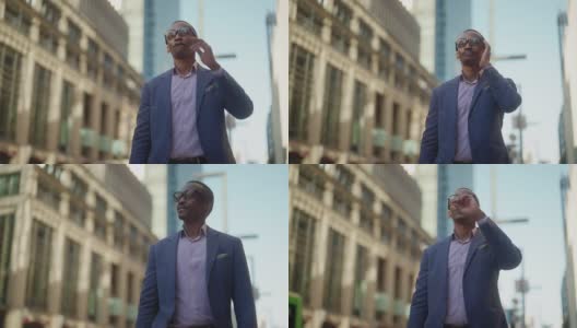 黑人商人戴着智能眼镜和通勤。黑人商人戴着智能眼镜，在增强现实元空间工作，参加商务会议，通勤于市中心的金融商务区。高清在线视频素材下载