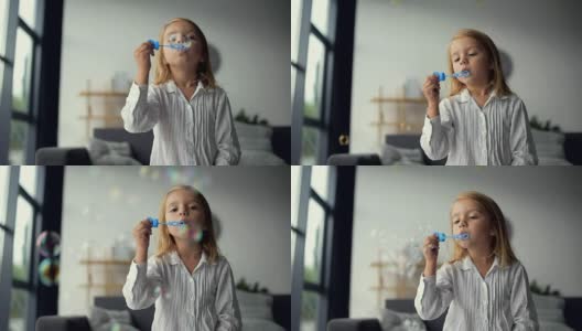 可爱积极的小女孩吹肥皂泡高清在线视频素材下载