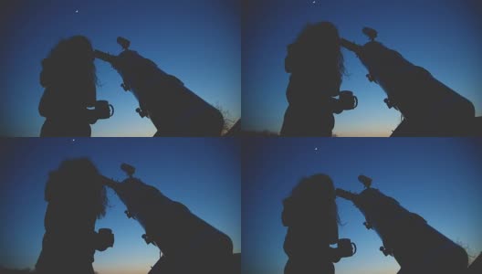 一个女孩的剪影，通过望远镜看星星在自然界。高清在线视频素材下载