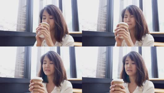 在咖啡馆喝咖啡的亚洲女人高清在线视频素材下载