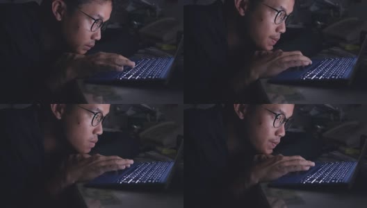 亚洲潮人用笔记本电脑和智能手机工作到很晚。高清在线视频素材下载
