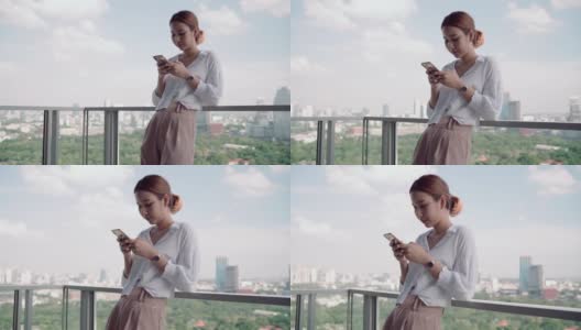年轻的亚洲女性在家里使用现代智能手机高清在线视频素材下载
