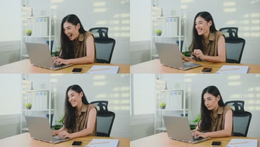 COVID-19在家工作，商业上的成功，亚洲女性平面设计师创意业务在电脑上工作，青年亚洲掩星获奖项目庆祝，快乐，积极满足的情绪高清在线视频素材下载