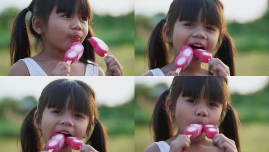 小女孩正带着积极的情绪，放松地吃着冰淇淋。高清在线视频素材下载