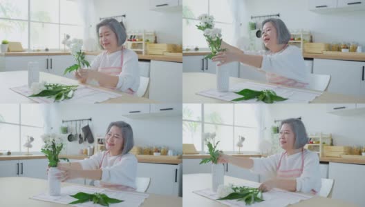 亚洲活跃的老年妇女和年轻的女儿在花瓶上插花。漂亮的奶奶和漂亮的孙女在家里装修厨房时感到很开心。家庭活动关系高清在线视频素材下载