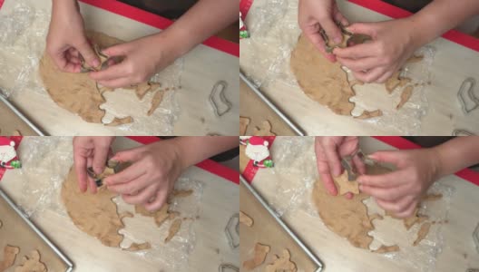 直接在上面摇摄视图:亚洲妇女的手压金属模具自制圣诞树饼干，姜饼，甘蔗糖，一颗星从面团庆祝圣诞节的12月。高清在线视频素材下载