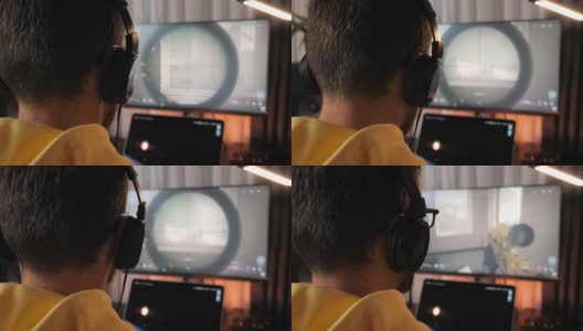 男玩家在功能强大的个人电脑上玩在线视频游戏。国务委员的游戏。年轻人沉迷于电子游戏，在电脑前浪费时间高清在线视频素材下载