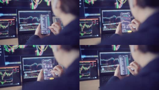 女人看着屏幕上的股票市场数据高清在线视频素材下载