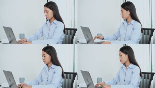 一段女商人在办公室用电脑工作时看起来很焦虑的4k视频高清在线视频素材下载