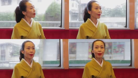 优雅的日本女子在京都乘坐火车高清在线视频素材下载