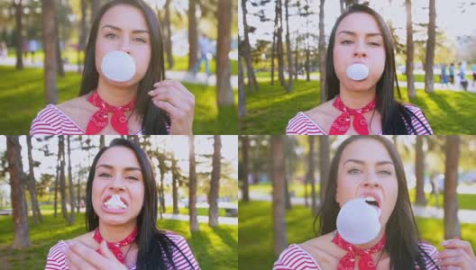 微笑的女人嚼着口香糖，吹着泡泡高清在线视频素材下载