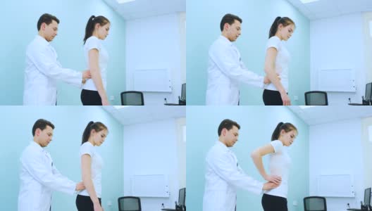 医生在康复柜中触摸少女的腰椎高清在线视频素材下载