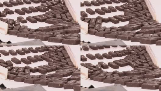 巧克力工厂传送带上的糖果高清在线视频素材下载