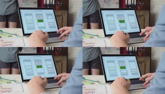 UX设计师在他的笔记本电脑上创建移动应用原型高清在线视频素材下载