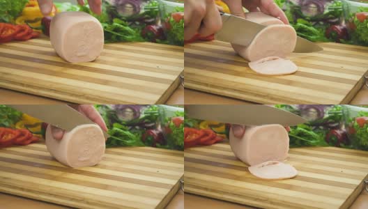 厨师在木板上用刀切火腿高清在线视频素材下载