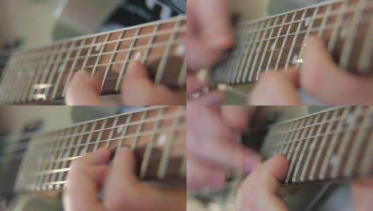 近距离的手指拨动吉他的和弦高清在线视频素材下载
