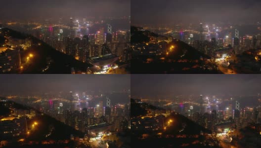 夜间照亮香港市景维多利亚山顶空中全景4k高清在线视频素材下载