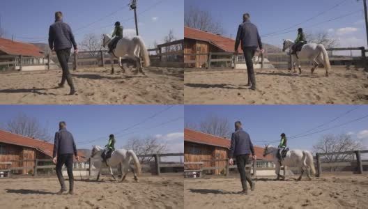 动物救援中心的骑师，教兴奋的女孩如何骑马高清在线视频素材下载