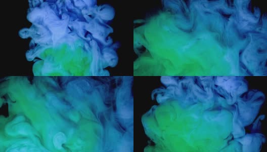 蓝色和绿色颜料滴在水中与黑色背景，抽象的颜色混合，墨颜料滴在水上。高清在线视频素材下载