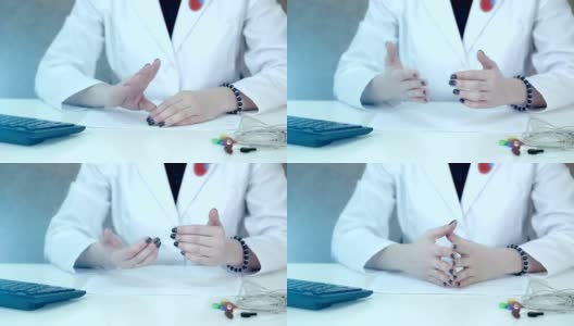 一个女医生的手的特写，在谈话过程中她的手在桌面上做手势高清在线视频素材下载