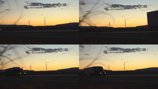 特写:轿车和半挂车在日落时分行驶在荒凉的乡村高清在线视频素材下载