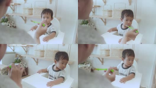 一个小婴儿(6-11个月)正在吃高清在线视频素材下载