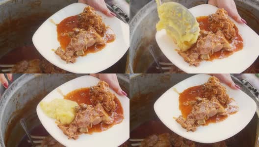 在一个大金属锅里炖的羊肉，和玉米粥一起食用高清在线视频素材下载