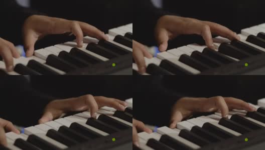 男性的手在钢琴上弹奏旋律高清在线视频素材下载