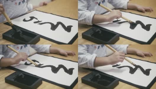 一个日本女孩在元旦写日本书法高清在线视频素材下载