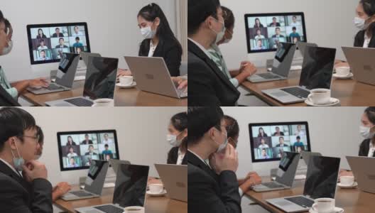年轻的亚洲员工和员工团队通过电脑进行Zoom视频电话会议，商务人士共用办公桌使用电脑共同工作，高清在线视频素材下载