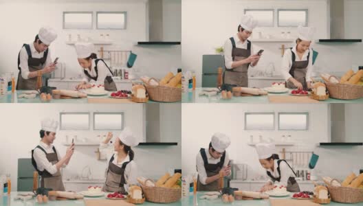 两个亚洲人在家里一起做饭时拍照高清在线视频素材下载
