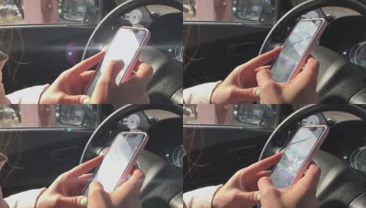 女人开车时用手机高清在线视频素材下载