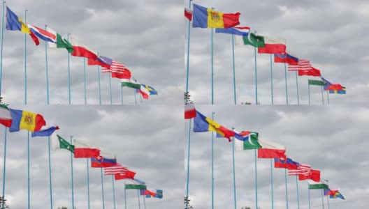 在旗杆上挥舞伊朗、摩尔多瓦、卢森堡、巴基斯坦、波兰、斯洛伐克、美国、土耳其、乌兹别克斯坦、捷克共和国和瑞典的国旗。人民之间友谊的概念高清在线视频素材下载