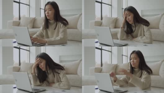 疲惫，疲惫的亚洲女人，手提电脑，项目的问题，感到沮丧，懒惰的家庭办公室在客厅高清在线视频素材下载