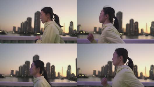 一个女人在日落时分跑过大桥的侧面照片高清在线视频素材下载
