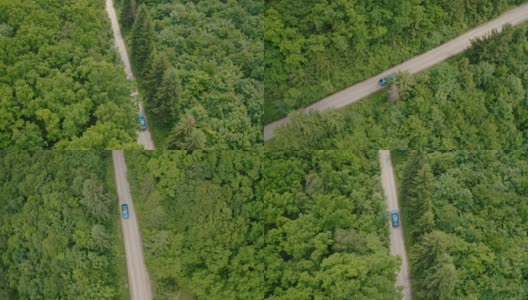 蓝色的汽车在夏天的路上行驶。在森林里开着一辆现代化的汽车。电动汽车对自然没有任何危害。空中轨道的看法。高清在线视频素材下载