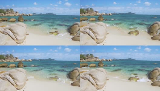慢镜头:华丽的热带海滩绿松石透明的水独特的巨石，金兰芽潭越南东南海岸旅游目的地，沙漠海滩没有人清澈的蓝天高清在线视频素材下载