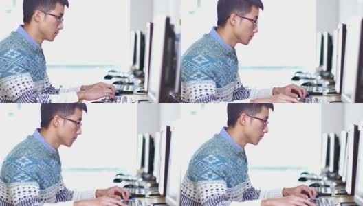 亚洲男子学生使用电脑高清在线视频素材下载