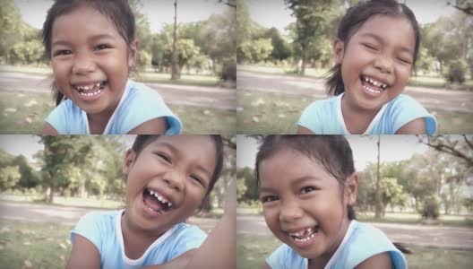 慢动作高清:美丽的亚洲小女孩笑了高清在线视频素材下载