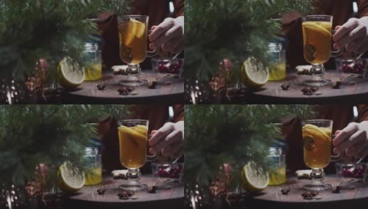 人们正在用手准备柠檬和蜂蜜的圣诞风味茶高清在线视频素材下载