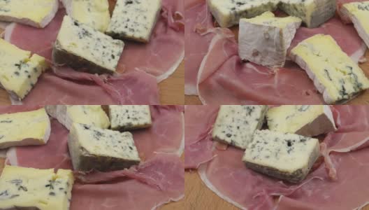 切片的火腿和蓝色的奶酪摆在一块木板上高清在线视频素材下载