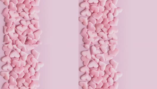 粉红色的情人节心形像画框一样在粉色的屏幕上移动。高清在线视频素材下载